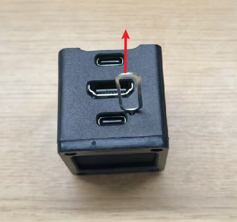 Lever the pin upward after inserting it into the hole to press the BOOT button inside
