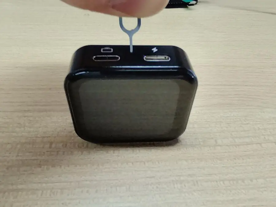 Press and hold the NanoKVM Go Reset button with a SIM eject pin
